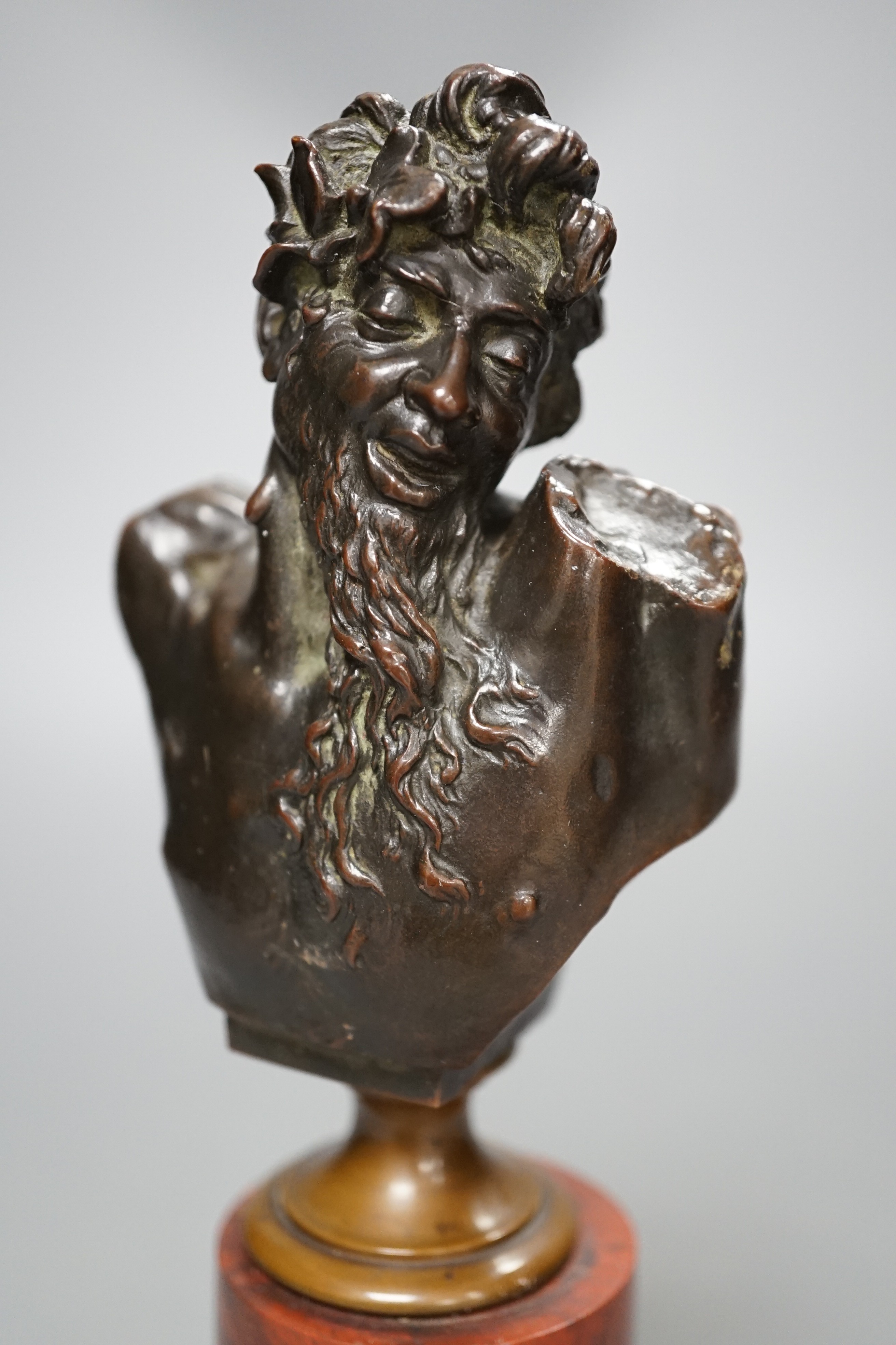 A bronze bust of Dionysus on a red marble stand circa 1900, 21cm